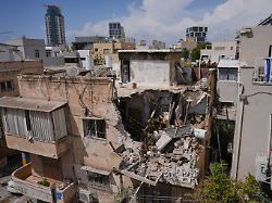 israeli home front command officers inspect an apartment building struck by an iranian missile in tel aviv israel sunday march 22 2026