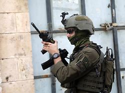 israeli soldiers stand guard during a weekly settlers tour in hebron in the israeli occupied west bank february 14 2026