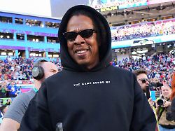 jay z walks on the field before the nfl super bowl 60 football game between the new england patriots and the seattle seahawks sunday feb 8 2026 in santa clara calif