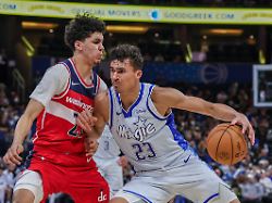 mar 12 2026 orlando florida usa orlando magic forward tristan da silva 23 drives past washington wizards guard will riley 27 during the second half at kia center