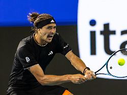 mar 27 2026 miami gardens fl usa alexander zverev of germany hits a backhand against jannik sinner of italy in the semi finals of the men s singles at the miami open at the hard rock stadium