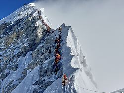 mountaineers form a queue as they approach the summit of mount everest in nepal may 18 2025