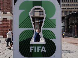 pedestrians pass the fifa world cup 2026 countdown clock in boston massachusetts u s march 18 2026