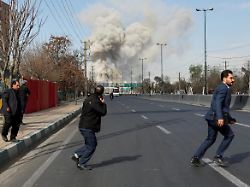 people run as smoke rises following an explosion amid the u s israeli conflict with iran in tehran iran march 5 2026 1
