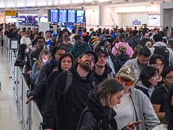people wait in long tsa security lines at john f kennedy international airport jfk in the queens borough of new york monday march 23 2026