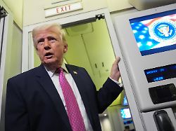 president donald trump speaks to reporters aboard air force one en route from west palm beach fla to joint base andrews md sunday march 29 2026