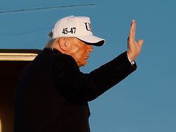 president donald trump waves from the stairs of air force one as he boards for departure joint base andrews md friday march 13 2026 ap photo luis m