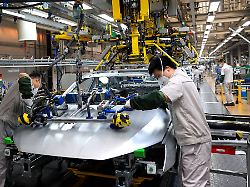 qingdao china february 28 employees work on the assembly line of vehicles at a workshop of faw volkswagen on february 28 2026 in qingdao shandong province of china