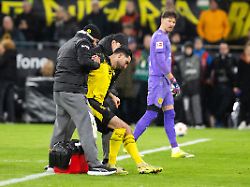 signal iduna park dortmund 28 02 2026 emre can of dortmund leaves injured the field during the 1 bl borussia dortmund vs fc bayern muenchen 1