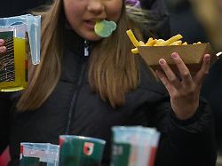 spectator with food and beer in the match fc augsburg vfl wolfsburg 1 0 on mar 15 2025 in augsburg germany season 2024 2025 1 bundesliga fca matchday 26 26