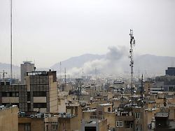 tehran iran march 13 smoke rises after airstrikes in tehran iran on march 13 2026