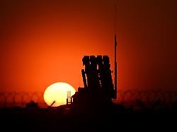 this photograph taken during sunset on march 6 2025 shows a patriot air defence system installed at the military hub for ukraine at the rzeszow jasionka airport in jasionka south east poland