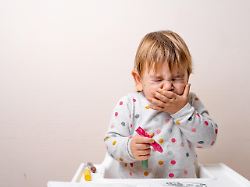 toddler child sneezing while drying with crayons baby with allergy or cold from daycare or kindergarten germs paediatric medicine