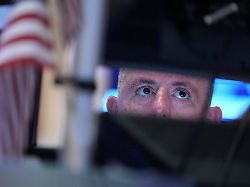 traders work on the floor at the new york stock exchange in new york tuesday march 10 2026