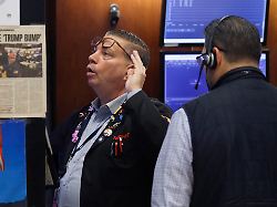 traders work on the floor of the new york stock exchange on wall street on friday december 19 2025 in new york city u s stocks rose on friday with the nasdaq up 1 percent