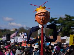 u s president donald trump s effigy is seen as demonstrators attend a no kings protest against president trump s administration policies in washington d c u s march 28 2026