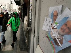 women walk past electoral posters of ayatollah alireza arafi a candidate for the upcoming assembly of experts elections in downtown tehran iran wednesday feb 21 2024