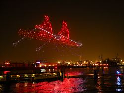 dpatopbilder 26 02 2026 hamburg drohnen bilden ein zweier boot im rudern ueber der elbe an den landungsbruecken waehrend einer show zum start der hamburger olympia kampagne des senats