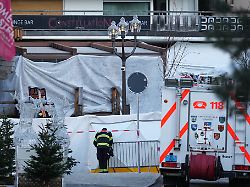 a fireworker watches the sealed off le constellation bar where a devastating fire left dead and injured during the new year s celebrations in crans montana swiss alps switzerland friday jan 2 2026
