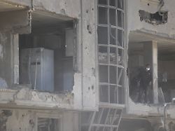 a man stands at his home damaged by a strike amid the u s israeli conflict with iran in tehran iran march 30 2026