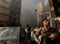 a soldier looks on at the site of an israeli strike in al mazraa in beirut lebanon april 8 2026