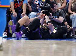 apr 2 2026 oklahoma city oklahoma usa los angeles lakers guard luka doncic 77 falls to the court during a play against the oklahoma city thunder during the third quarter at paycom center