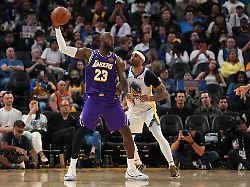 apr 9 2026 san francisco california usa los angeles lakers forward lebron james 23 holds onto the ball next to golden state warriors guard gary payton ii 0 in the third quarter at the chase center