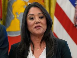 file labor secretary lori chavez deremer listens as president donald trump speaks with reporters while signing executive orders in the oval office of the white house april 23 2025 in washington