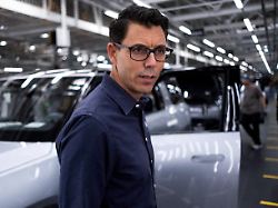 file photo rivian ceo rj scaringe tours the inside of electric auto maker rivian s manufacturing facility in normal illinois u s june 21 2024