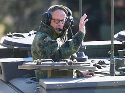 german chancellor friedrich merz drives in the armoured fighting vehicle boxer during his visit to the army at the bundeswehr base in munster germany thursday april 30 2026