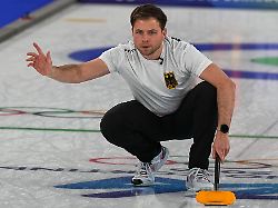 germany s marc muskatewitz in action during the men s curling round robin session against china at the 2026 winter olympics in cortina d ampezzo italy thursday feb 19 2026 1