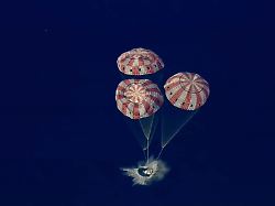 in this image from video provided by nasa the artemis ii orion capsule splashes down in the pacific ocean on friday april 10 2026