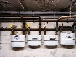 mehrere gaszaehler und rohre in einem keller in duesseldorf deutschland editorial use only several gas meters and pipes in a basement in duesseldorf germany editorial use only