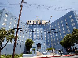 people walk past the church of scientology of los angeles building in los angeles california july 3 2012