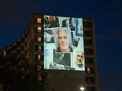photos of late financier and convicted sex offender jeffrey epstein are projected onto the washington hilton in washington d c u s april 24 2026