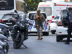 police officers work at the scene after gunfire was heard near the building housing the israeli consulate according to a witness in istanbul turkey april 7 2026