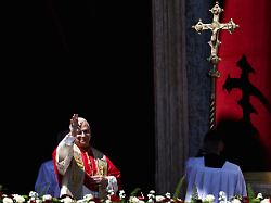 pope leo xiv gestures following his urbi et orbi to the city and the world message from the main balcony of st peter s basilica on easter sunday at the vatican april 5 2026