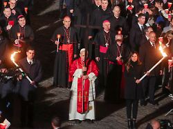 pope leo xiv holds a cross as he presides over the via crucis way of the cross procession during good friday celebrations at the colosseum in rome italy april 3 2026