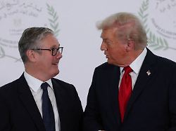 president donald trump and british prime minister keir starmer speak as they pose for a photo in sharm el sheikh egypt monday oct 13 2025