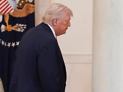 president donald trump departs after speaking about the iran war from the cross hall of the white house on wednesday april 1 2026 in washington