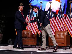 republican presidential nominee former president donald trump speaks with tucker carlson during a tucker carlson live tour show at desert diamond arena thursday oct 31 2024 in glendale ariz
