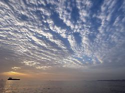 the sun rises behind a tanker anchored in the strait of hormuz off the coast of qeshm island iran saturday april 18 2026
