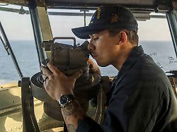 this image provided by u s central command shows a navy sailor standing watch on the bridge of the uss abraham lincoln cvn 72 in support of operation epic fury on sunday march 1 2026 u s