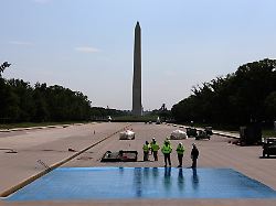 work begins to coat the lincoln memorial reflecting pool in a blue hued swimming pool surface friday april 24 2026 on the national mall in washington