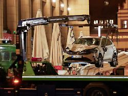 a car which drove into a group of people is lifted at the scene of a deadly incident in leipzig germany may 5 2026