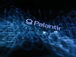 a laptop keyboard and palantir logo displayed on a phone screen are seen in this multiple exposure illustration photo taken in krakow poland on may 18 2026