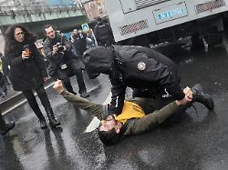 an union member is detained by a turkish police officer as people try to march towards taksim square in istanbul turkey friday may 1 2026 during labor day celebrations