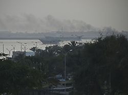 black smoke rises in the direction of a port in bandar abbas southern iran on may 5 2026 the standoff between the united states and iran continues over the strait of hormuz off the iranian port city