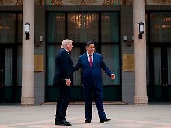 chinese president xi jinping right guides u s president donald trump during a visit to the zhongnanhai garden in beijing china friday may 15 2026 1