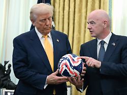 file fifa president gianni infantino right presents president donald trump with the new fifa club world cup official ball in the oval office of the white house in washington march 7 2025